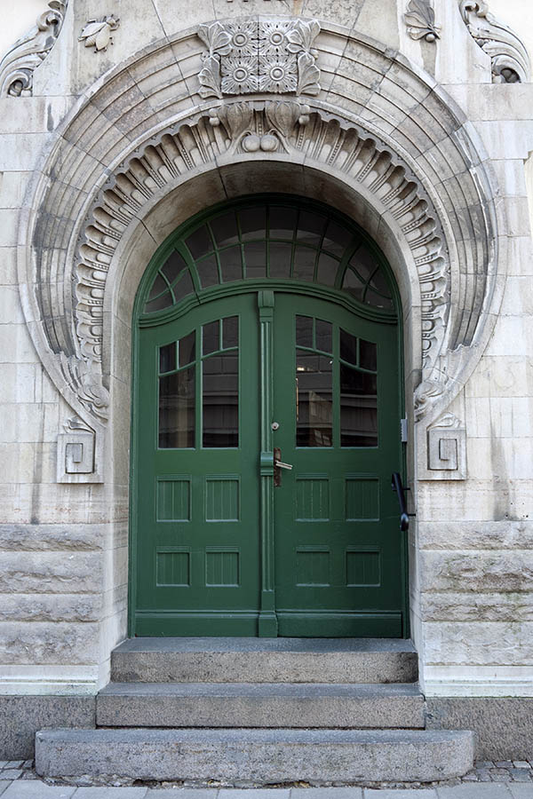 Photo 10354: Formed, carved, green double door with fan light and an excessively decorated marble pilaster