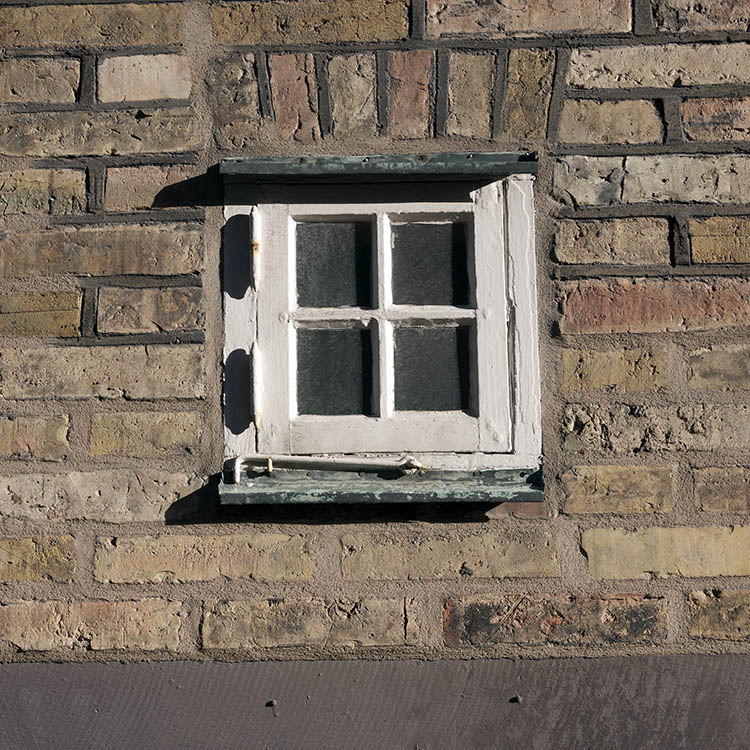 Photo 10394: Tiny, white window with four panes