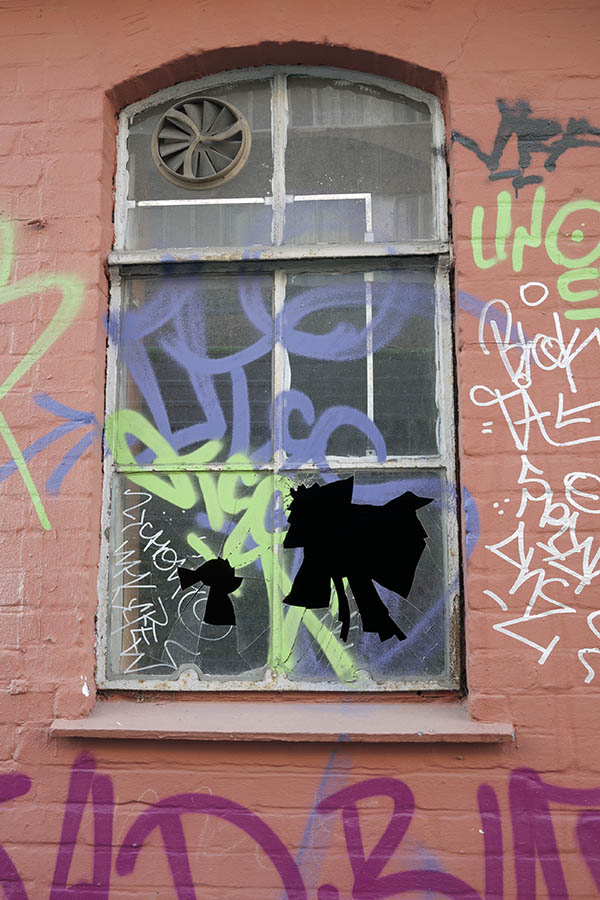 Photo 10538: Formed, grey metal window with two frames and six panes