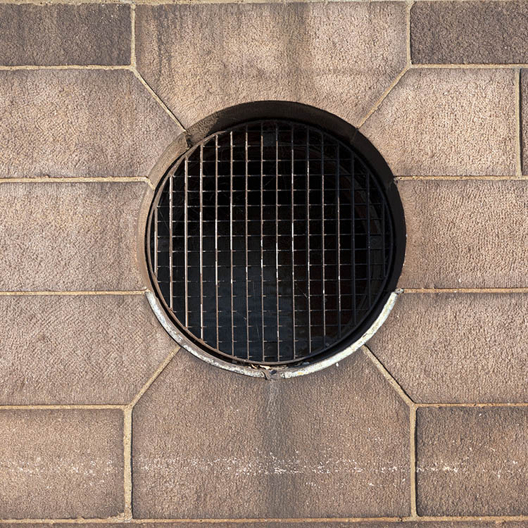 Photo 10734: Round, brown metal venthole window