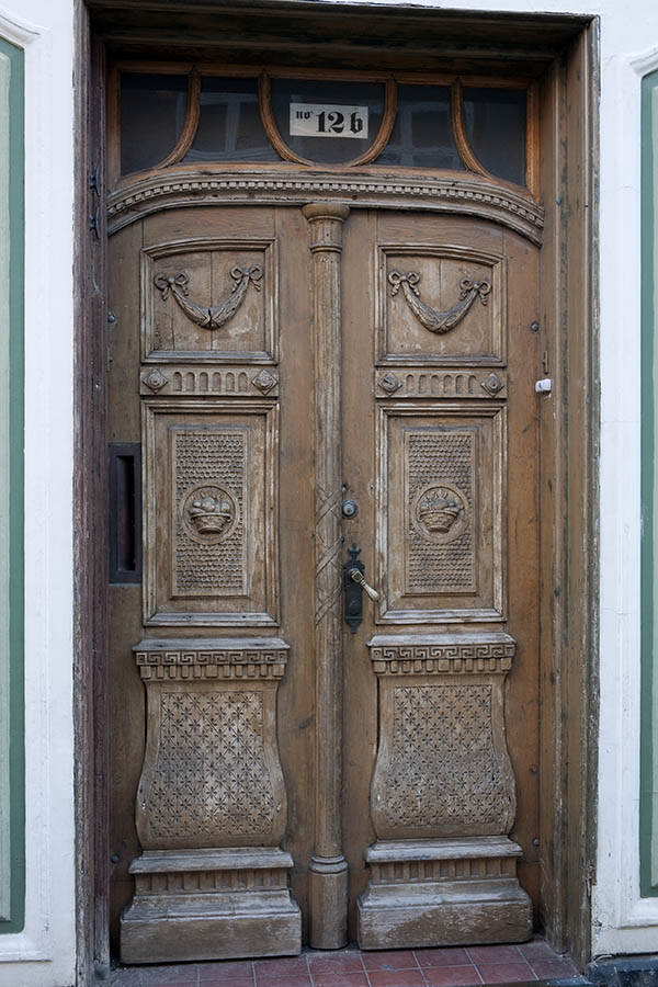 Photo 10809: Worn, carved, formed, brown double door with top window