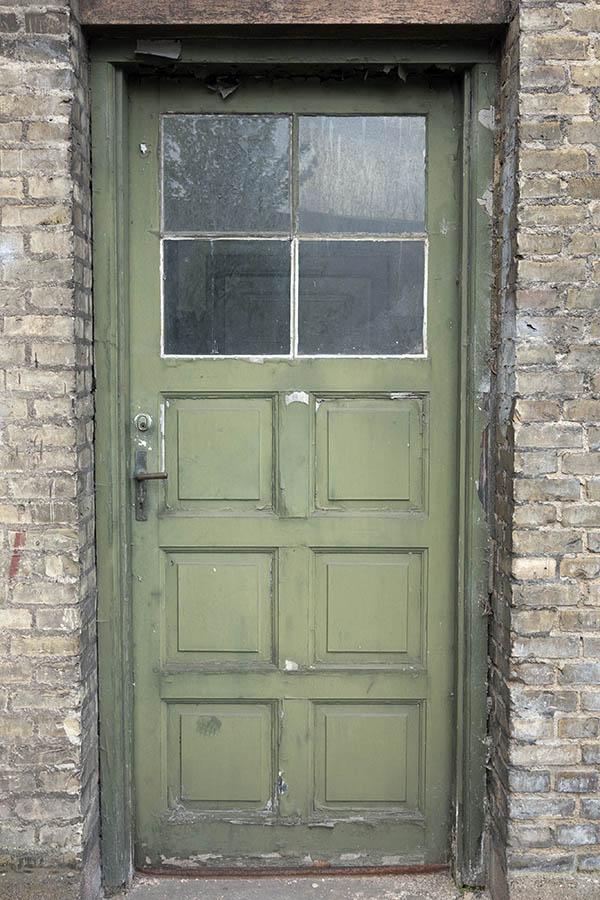 Photo 10956: Decayed, panelled, light green door with door light