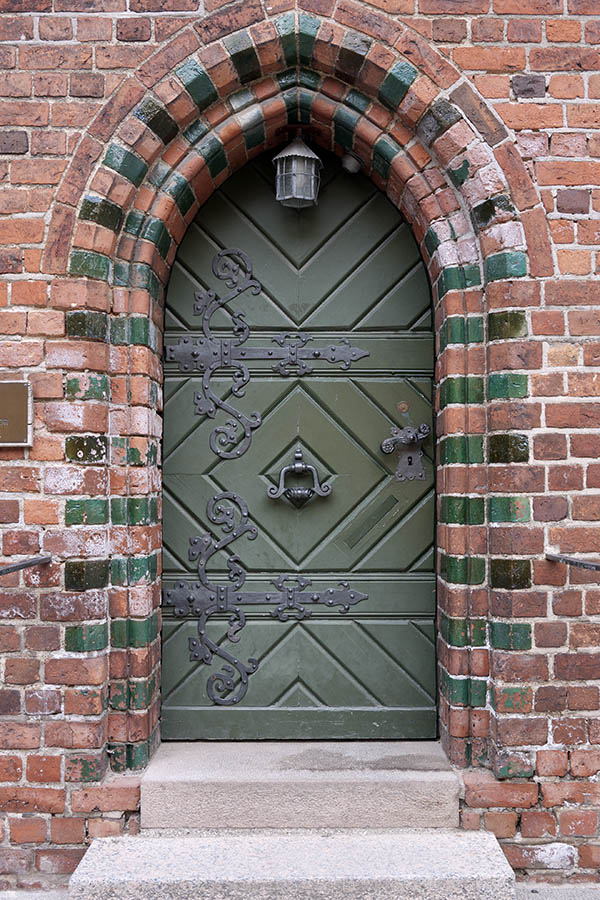 Photo 10994: Little, formed, green door made of planks
