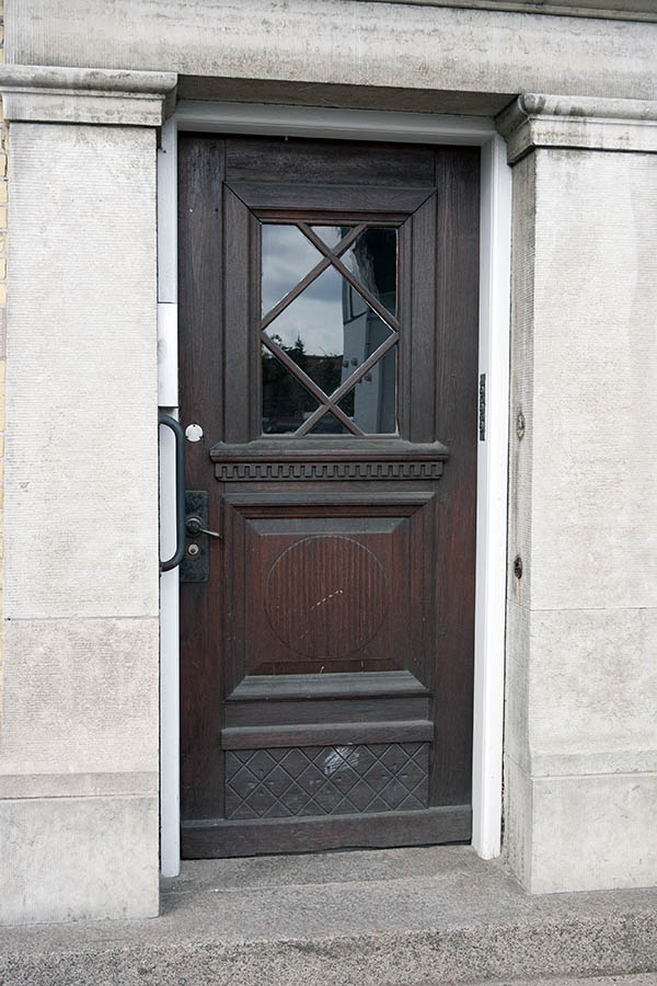 Photo 11042: Carved, panelled, brown door with door light