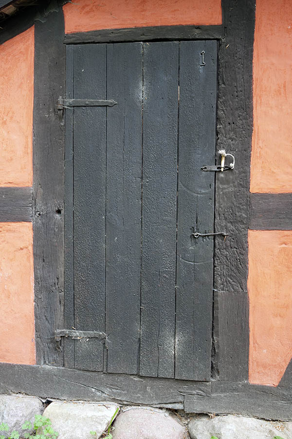 Photo 11089: Worn, black door made of planks