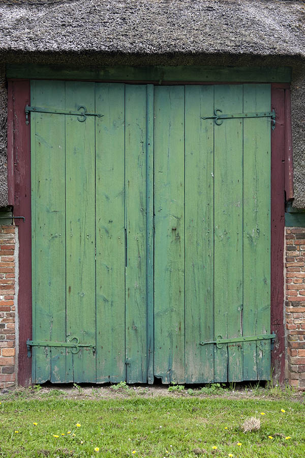 Photo 11112: Worn, lopsided, green and red gate made of planks