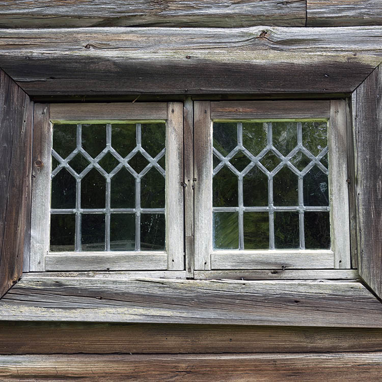Photo 11335: Little, unpainted window with two frames and 34 panes