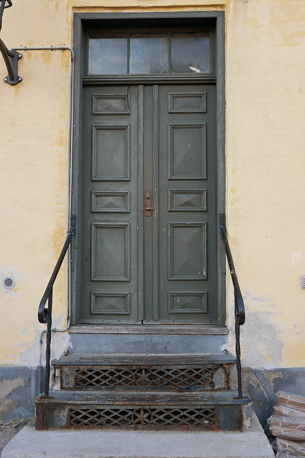 Photo 11370: Panelled, green double door with top window