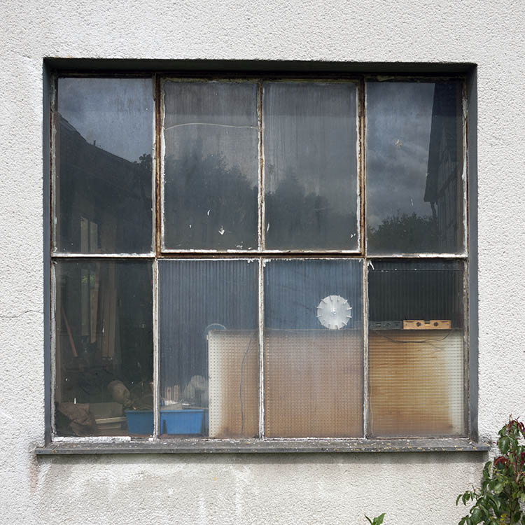Photo 12003: Unpainted metal window with eight panes