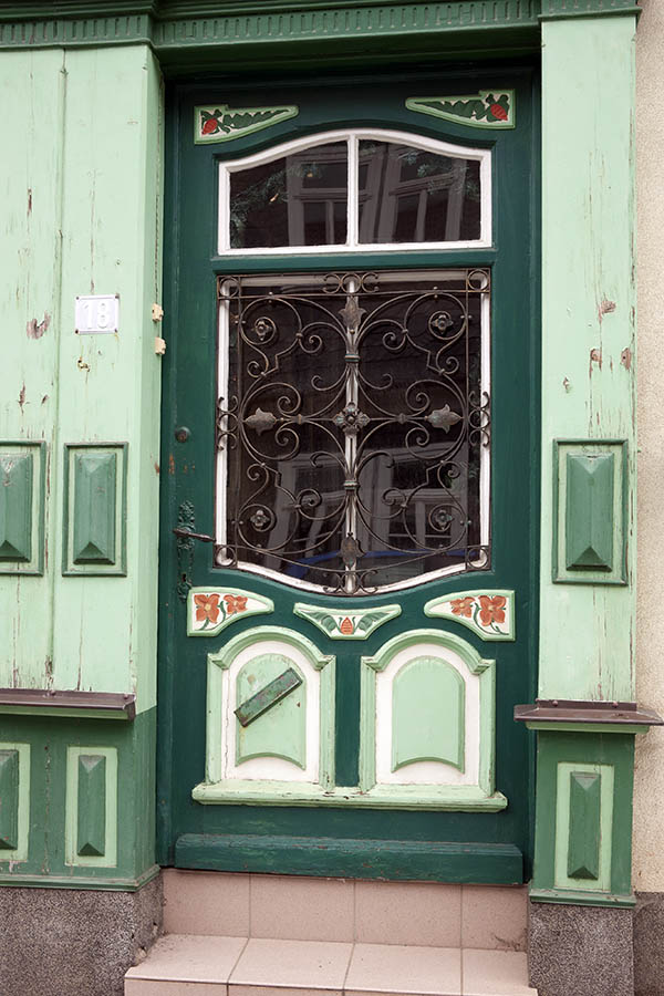 Photo 12194: Formed, carved, panelled, green, light green, white and red door with lattice