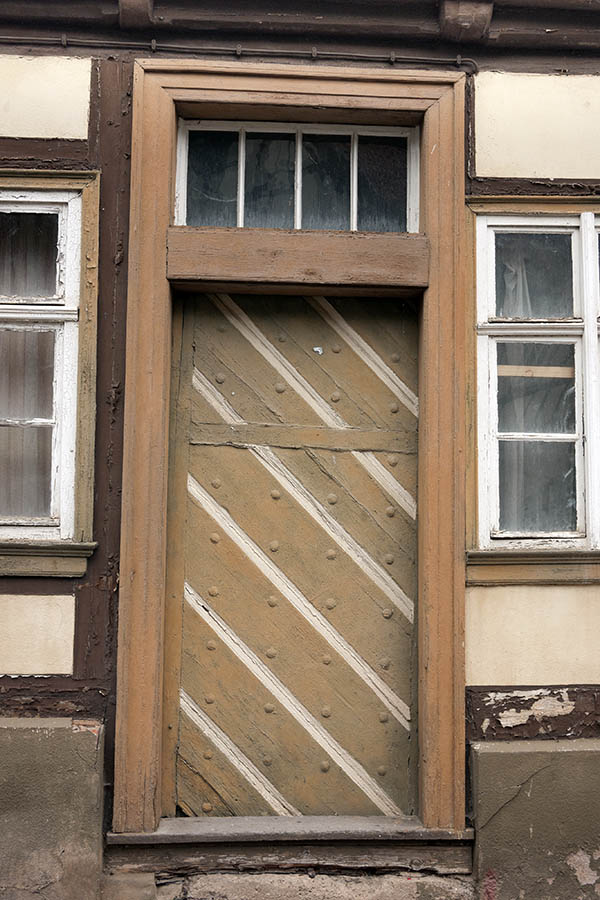 Photo 12317: Worn, light brown and white door with top window