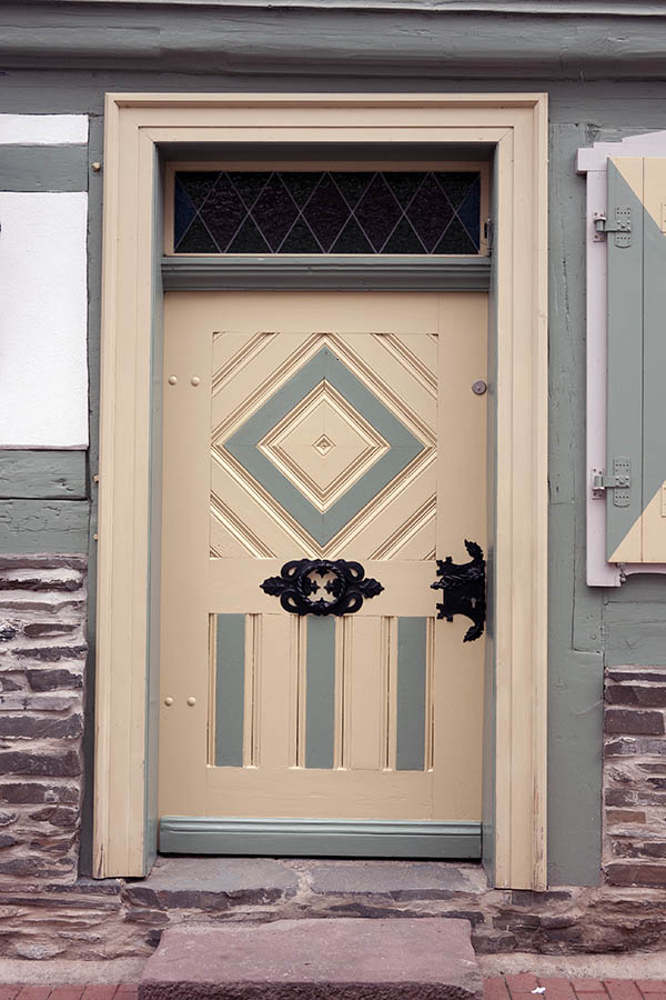 Photo 12380: Wide, panelled, yellow and light green door with top window