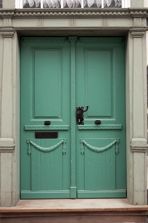 Photo 12392: Carved, panelled, light green double door
