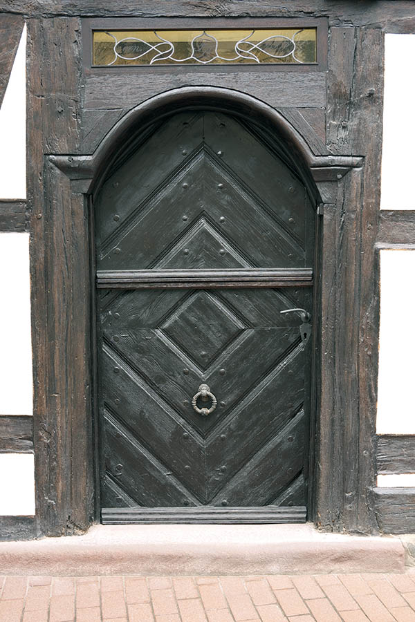 Photo 12491: Formed, black half-door made of planks with top window