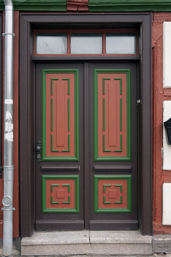 Photo 12597: Wide, panelled, brown, green and orange door with top window
