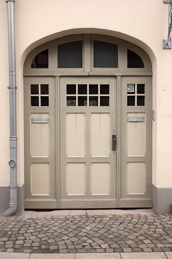 Photo 12611: Panelled, light yellow gate with fan light and door lights