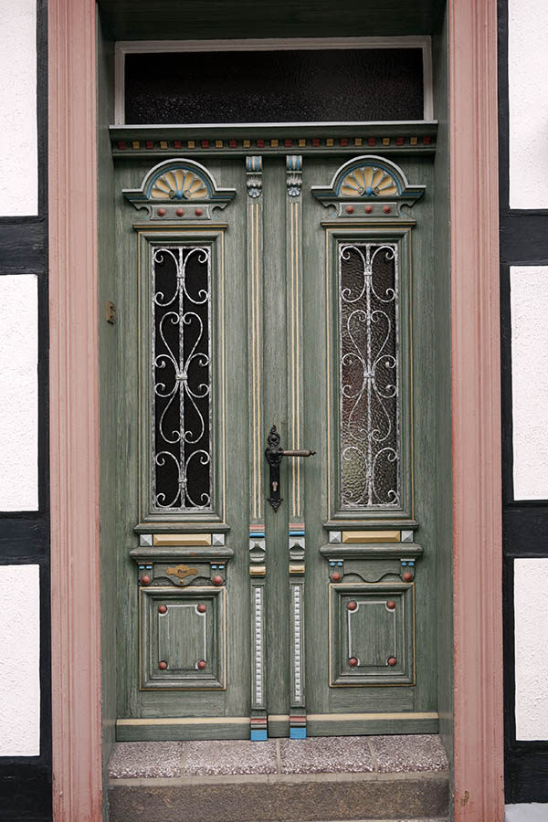 Photo 12651: Carved, panelled, green, yellow, blue and red double door with top window, door lights and lattice