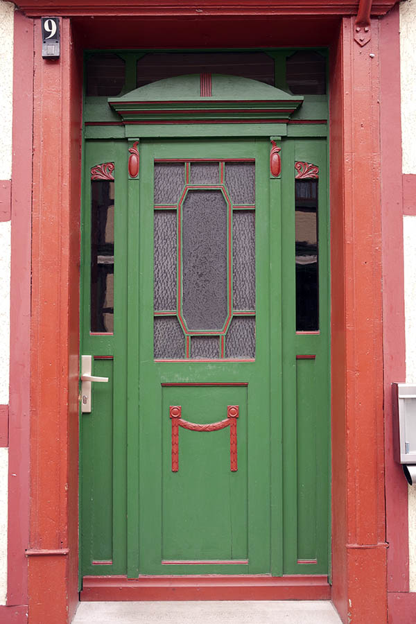 Photo 12657: Carved, panelled, green and red door with door lights