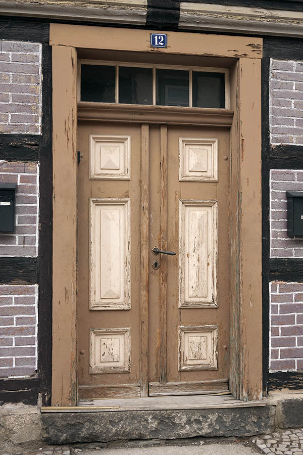Photo 12732: Decayed, panelled, light brown and light yellow double door with top window
