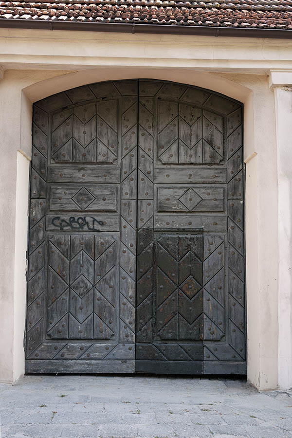 Photo 13028: Panelled, formed, unpainted gate with minor door