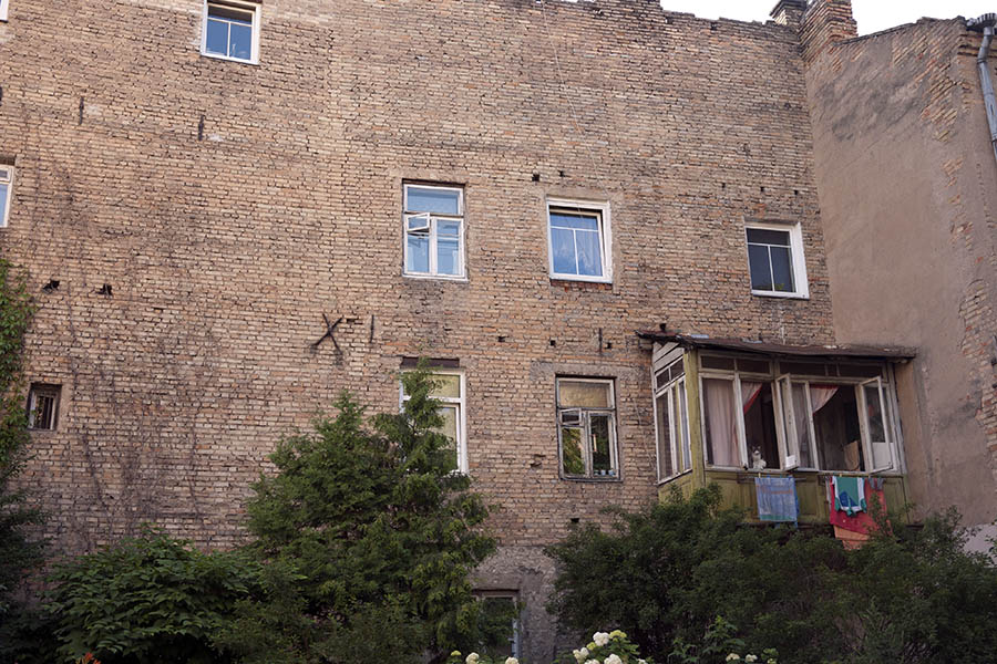Photo 13048: Facade of yellow bricks with white windows