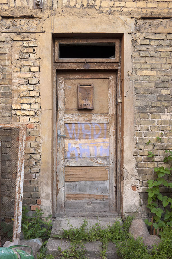 Photo 13080: Decayed, panelled, brown door with top window