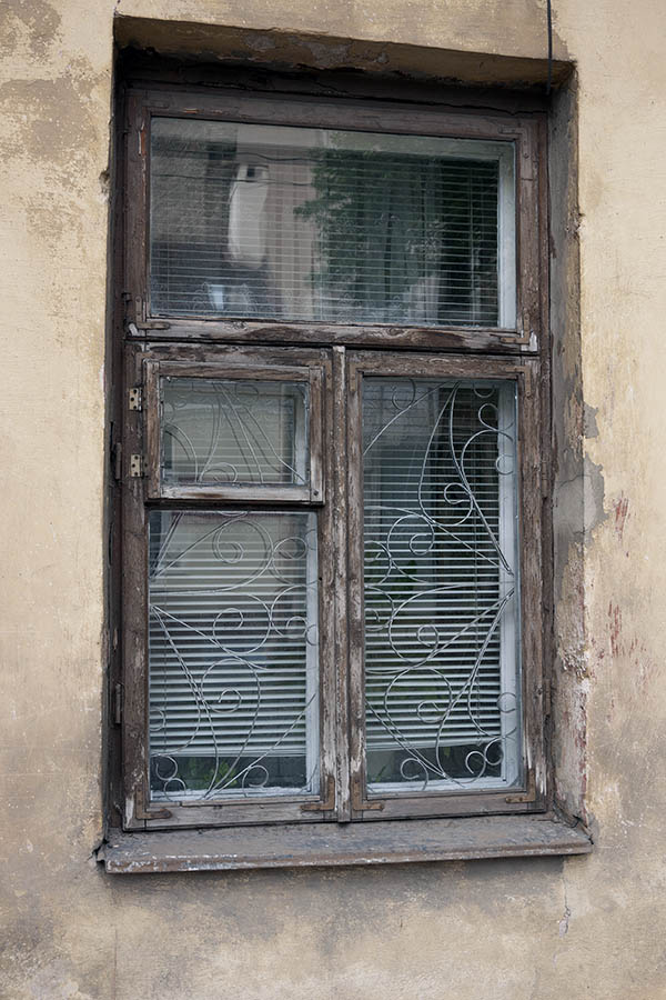 Photo 13304: Worn, brown, unpainted window with three frames