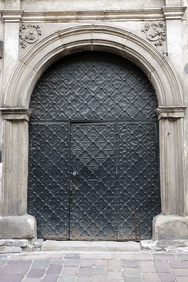 Photo 13606: Black gate with metal decoration and minor door
