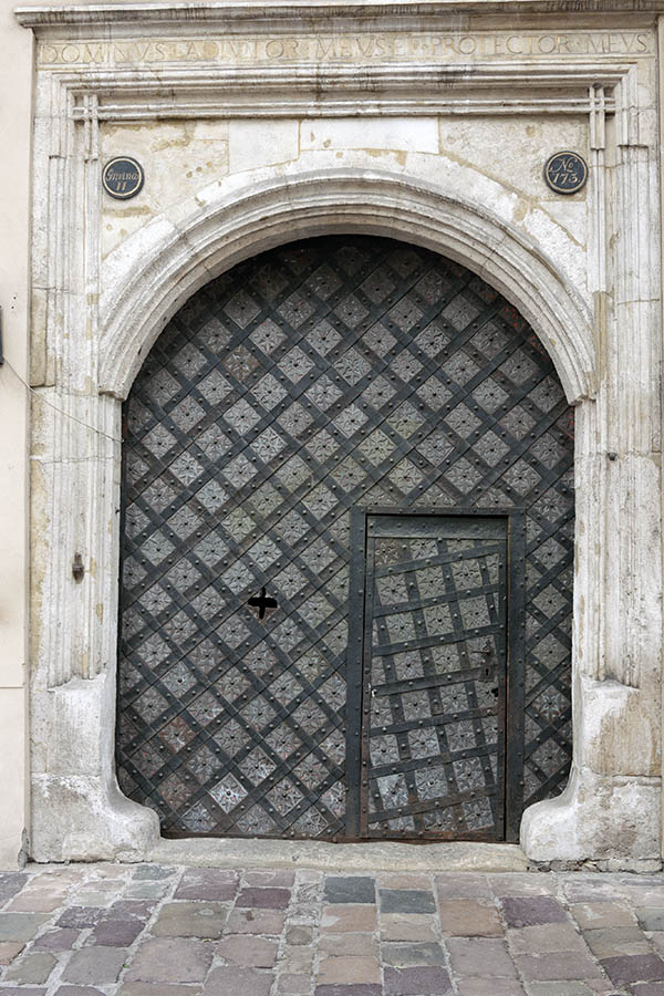 Photo 13612: Grey gate with black metal decoration and minor door