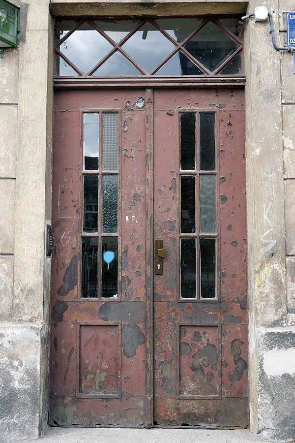 Photo 13680: Worn, panelled, brown double door with top window and door lights