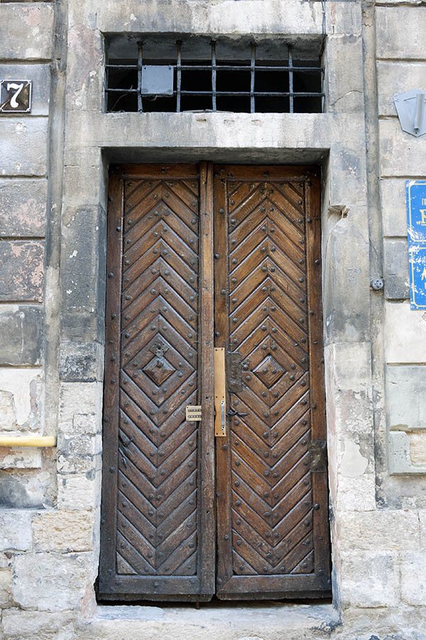 Photo 13749: Narrow, panelled, lacquered double door with barred top window