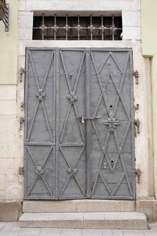 Photo 13783: Grey metal double door with barred top window