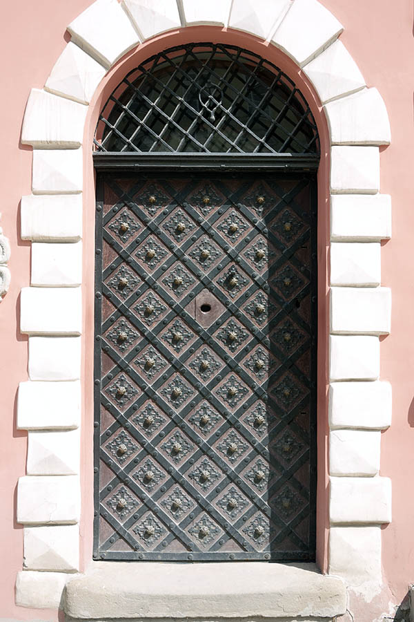 Photo 13817: Brown door with latticed fan light, decorated with black metal