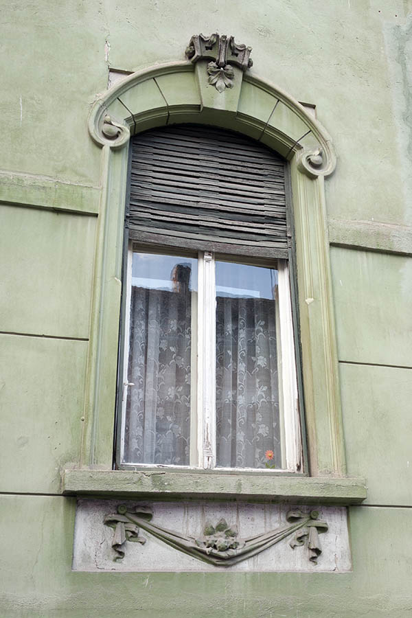 Photo 14199: Narrow, white window with two frames and security shutter