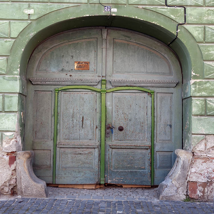 Photo 14488: Formed, carved, panelled grey and green gate with two minor doors