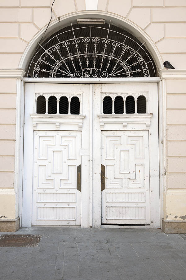 Photo 14499: Lopsided, carved, panelled, white gate with formed door lights and latticed, white fan light