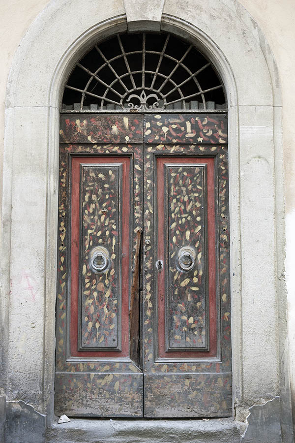 Photo 14752: Panelled, brown, yellow and red double door with barred fan light