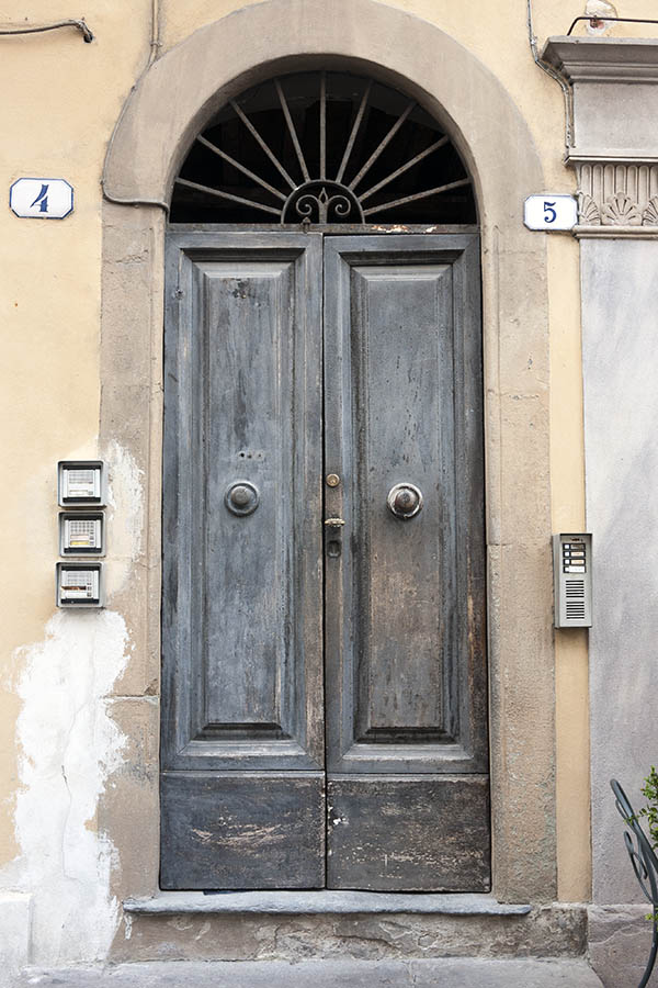 Photo 14949: Panelled, unpainted, grey double door with latticed fan light