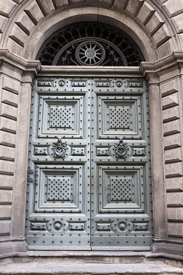 Photo 15011: Large, panelled, grey double door with fan light and many black nails
