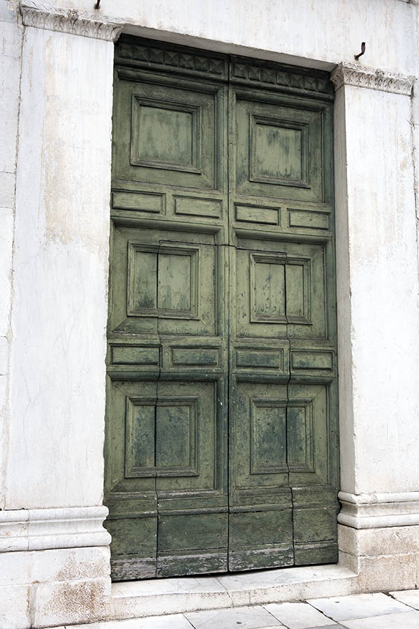 Photo 15038: Worn, panelled, green gate with minor doors