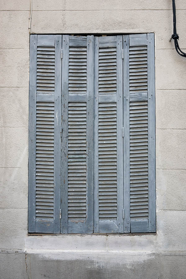 Photo 15284: Worn, narrow, grey folding shutters