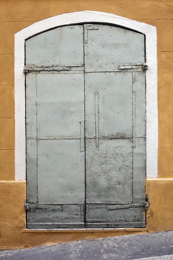 Photo 15336: Worn, formed, grey double door covered with plates