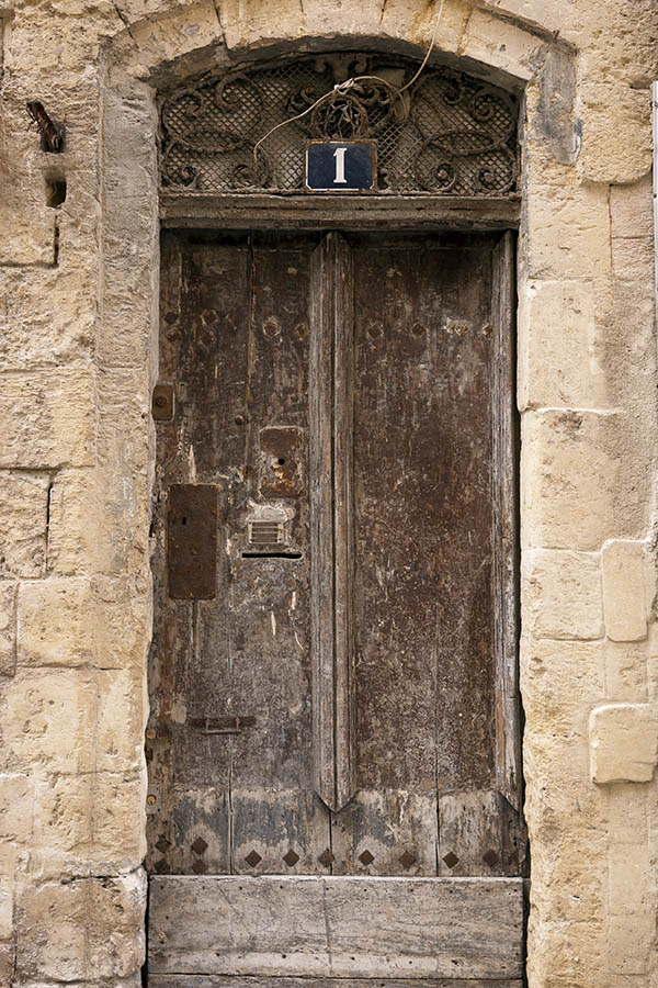 Photo 15396: Decayed, panelled, unpainted, brown door with latticed fan light