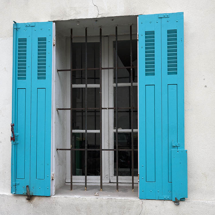 Photo 15434: White, barred window with two frames, six panes and turquoise folding shutters