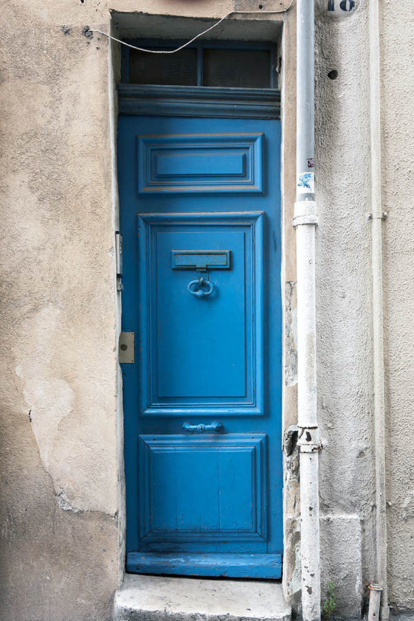 Photo 15456: Lopsided, panelled, light blue door with lopsided top window