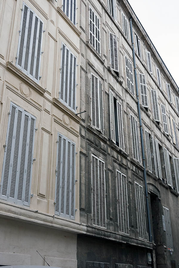 Photo 15521: Facade with 28 pairs of narrow, grey folding shutters