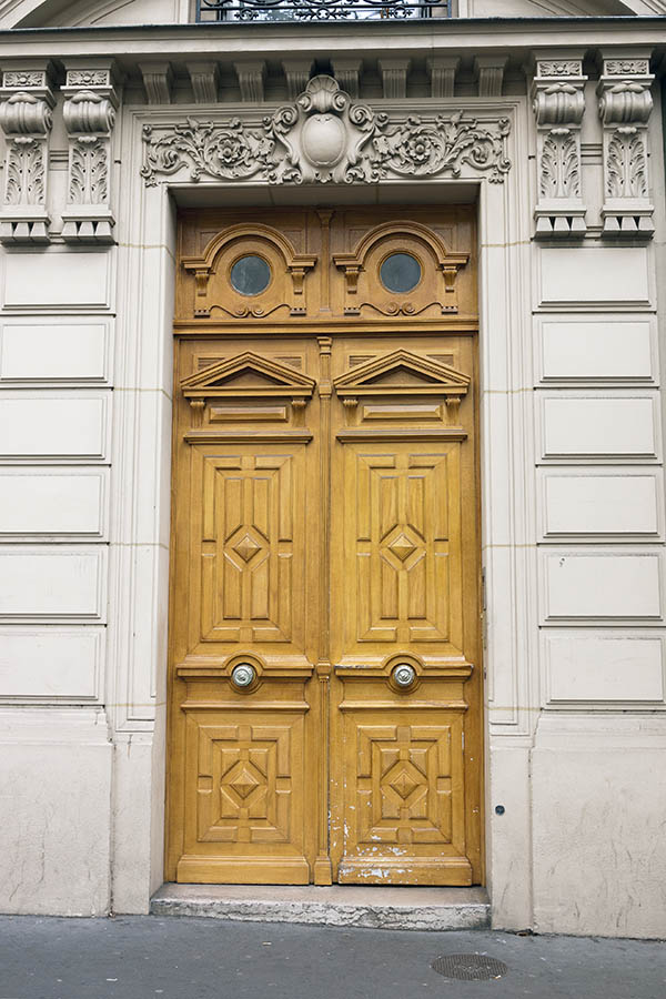 Photo 15559: Carved, panelled, yellow double door with formed, round top windows
