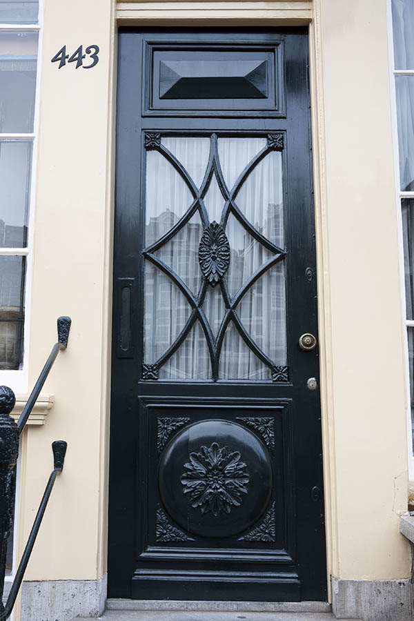 Photo 16108: Carved, panelled, black door with decorated door light