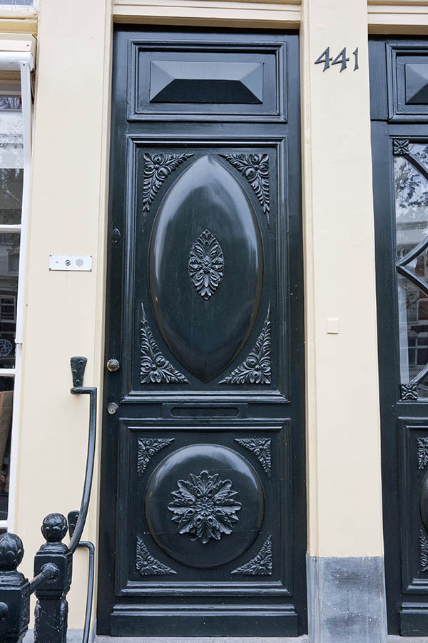 Photo 16110: Carved, panelled, black door