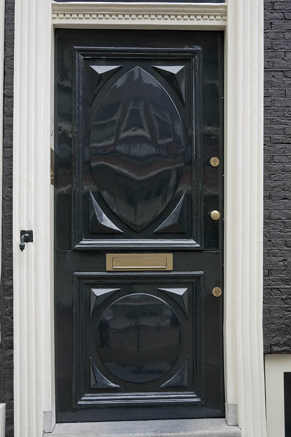 Photo 16162: Carved, panelled, dark blue and white door